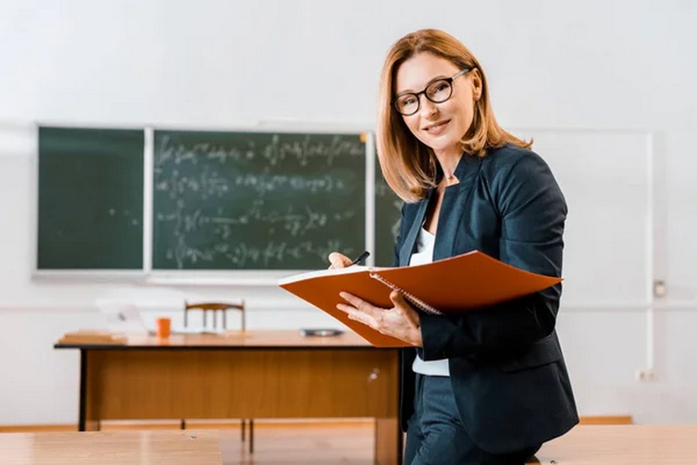 depositphotos 229020394 stock photo beautiful female teacher formal wear
